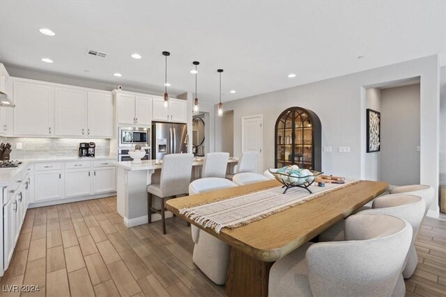 dining room featuring light hardwood / wood-style floors