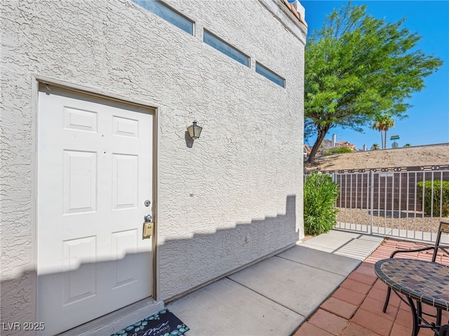 doorway to property featuring a patio area