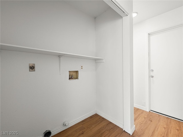 clothes washing area featuring hardwood / wood-style flooring, gas dryer hookup, and hookup for a washing machine