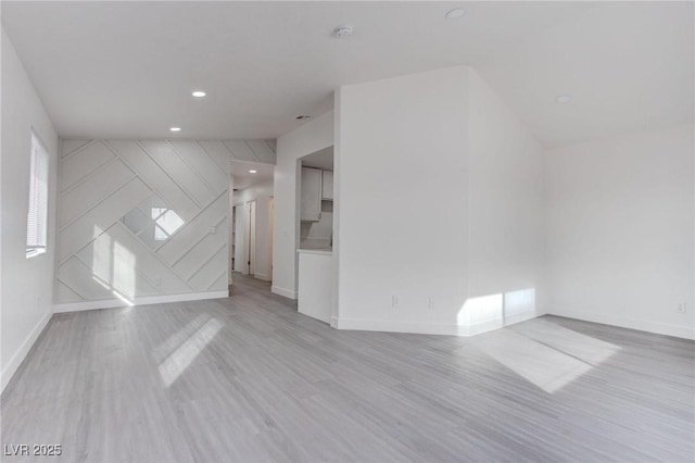 additional living space with light wood-type flooring