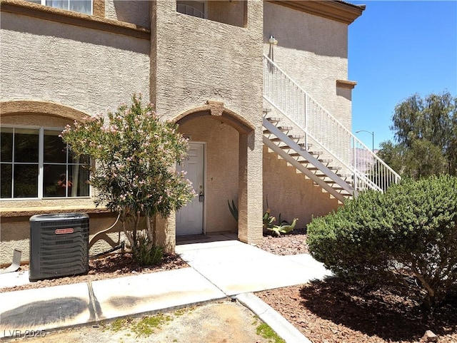 doorway to property featuring central AC