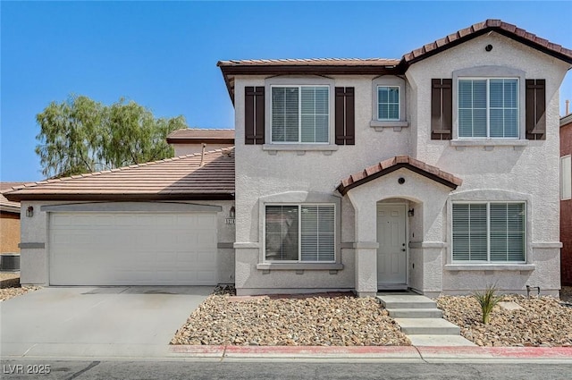 view of front of home with a garage and central air condition unit