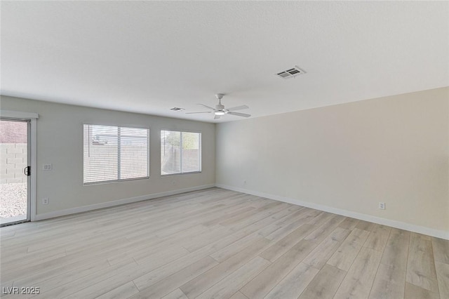 unfurnished room with ceiling fan and light wood-type flooring