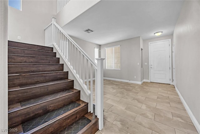 stairway featuring tile patterned floors