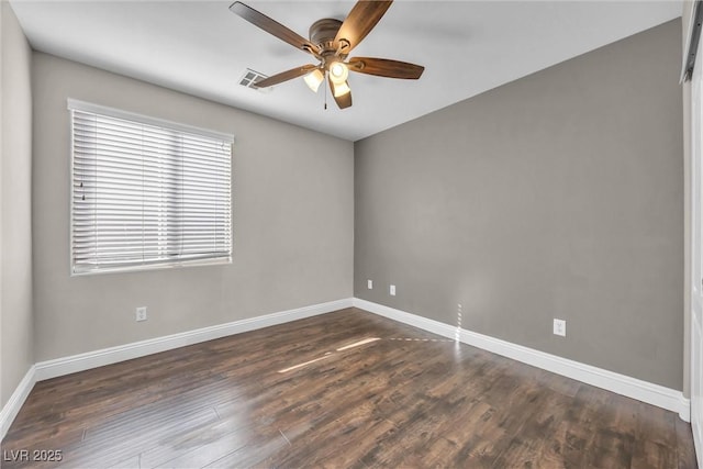 unfurnished room with ceiling fan and dark hardwood / wood-style floors