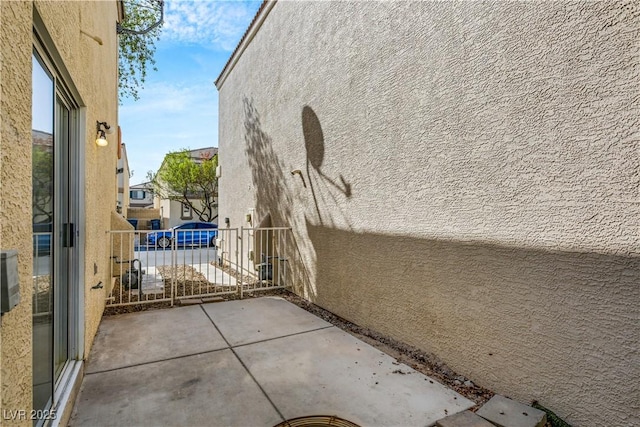 view of property exterior featuring a patio