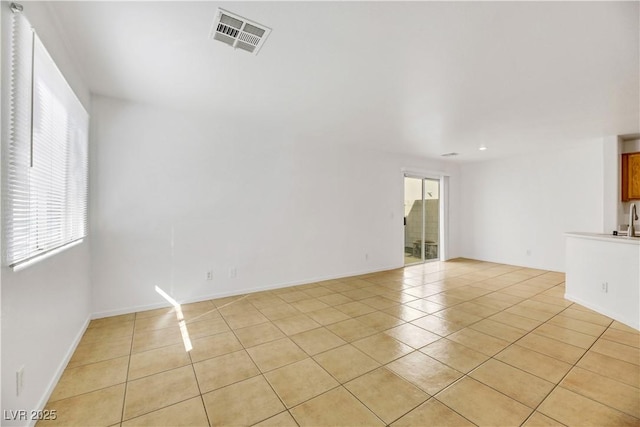 tiled spare room with sink