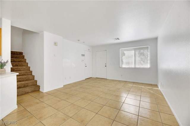 spare room with light tile patterned flooring