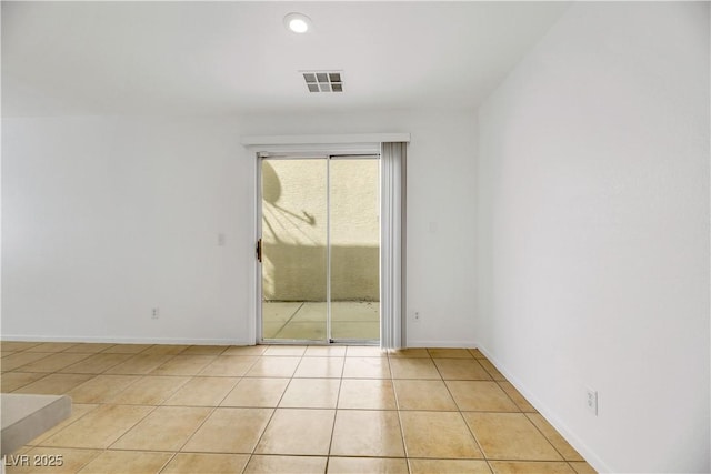 spare room featuring light tile patterned floors