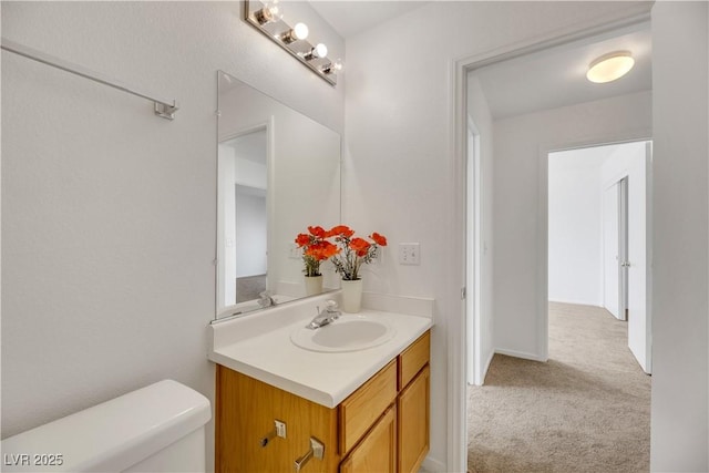 bathroom with vanity and toilet