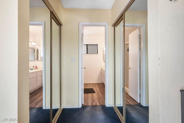 hallway featuring dark wood-type flooring