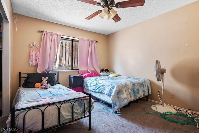 carpeted bedroom with ceiling fan and a textured ceiling