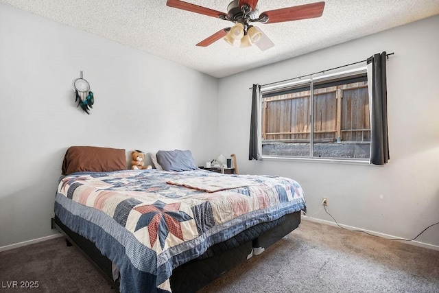 bedroom with carpet, a textured ceiling, and ceiling fan