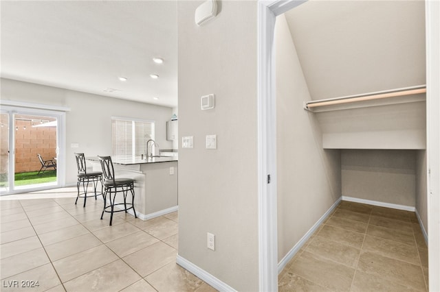 interior space featuring sink and light tile patterned floors