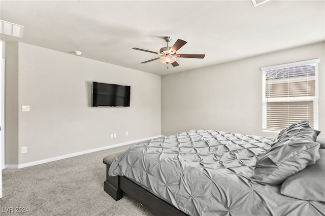 bedroom with ceiling fan and carpet floors