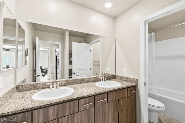 full bathroom with bathing tub / shower combination, vanity, and toilet