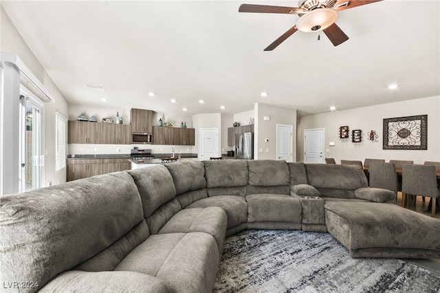 living room with ceiling fan