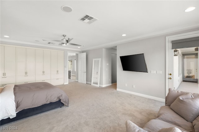 carpeted bedroom featuring a closet and ceiling fan