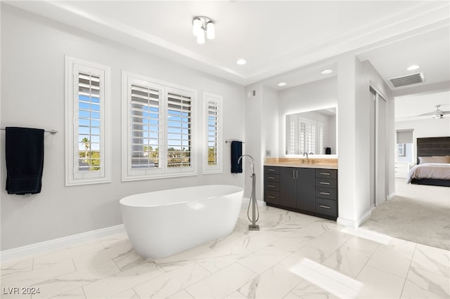 bathroom with a bathing tub and vanity