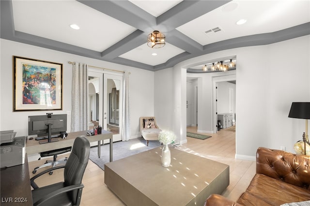 office with beam ceiling, light hardwood / wood-style flooring, french doors, and coffered ceiling