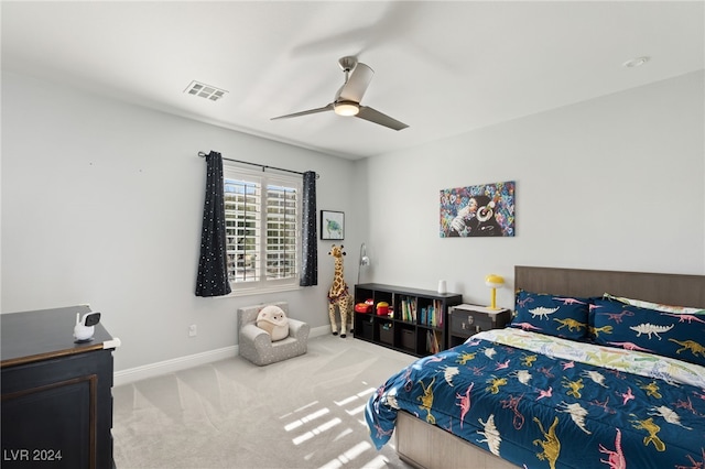 bedroom with ceiling fan and light carpet