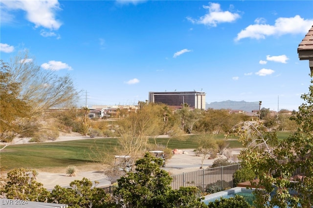 view of community with a lawn and a mountain view