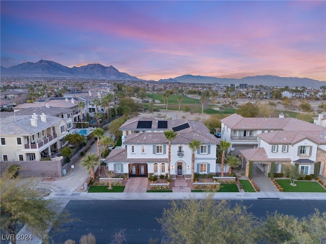 aerial view at dusk with a mountain view