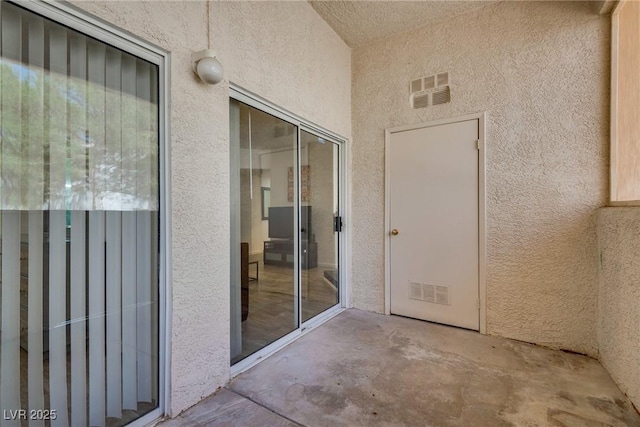 property entrance with a patio area