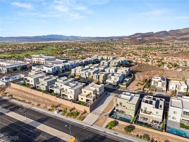 birds eye view of property featuring a mountain view