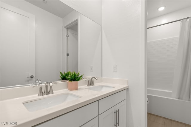 bathroom featuring tile patterned flooring, vanity, and shower / bath combination with curtain