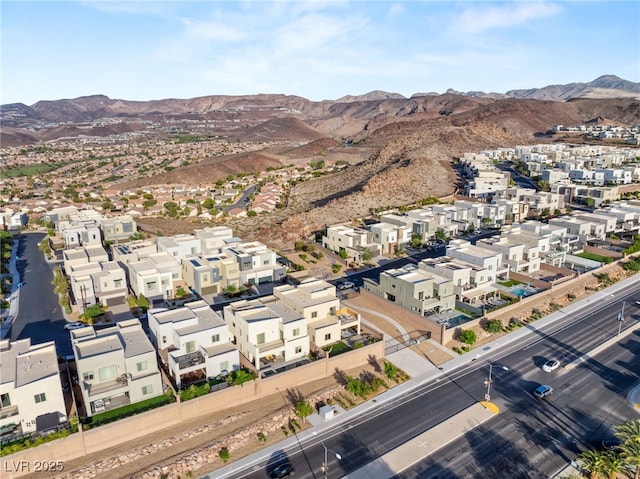 birds eye view of property featuring a mountain view