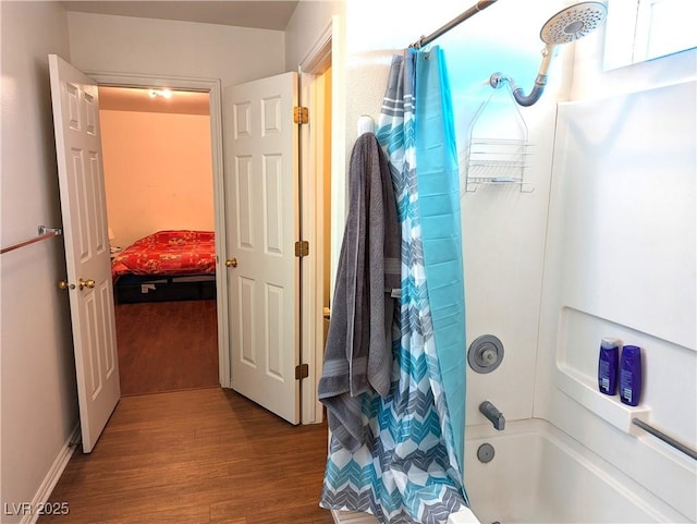 bathroom with wood-type flooring and shower / bath combination with curtain