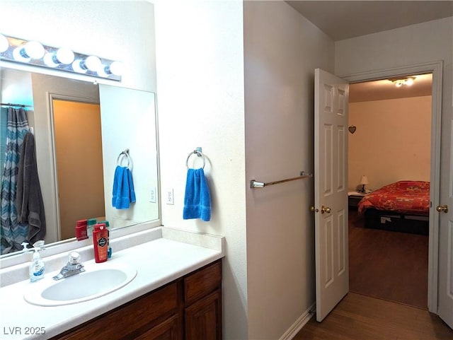 bathroom featuring vanity and hardwood / wood-style floors