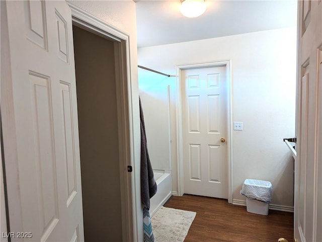 2327 Iron Dr, Ely, NV 89301 - full bath with wood finished floors, bathing tub / shower combination, and baseboards