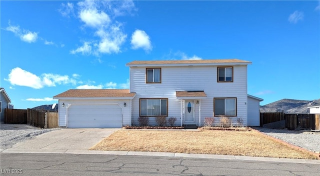 2327 Iron Dr, Ely, NV 89301 - traditional-style house featuring a garage, fence, and driveway