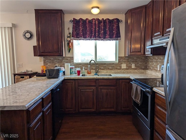 kitchen featuring extractor fan, sink, dark hardwood / wood-style floors, stainless steel appliances, and backsplash