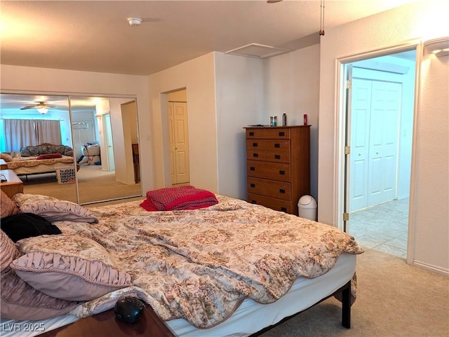 bedroom with light carpet and a closet