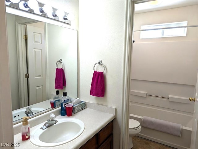 2327 Iron Dr, Ely, NV 89301 - bathroom featuring vanity, toilet, and tile patterned floors