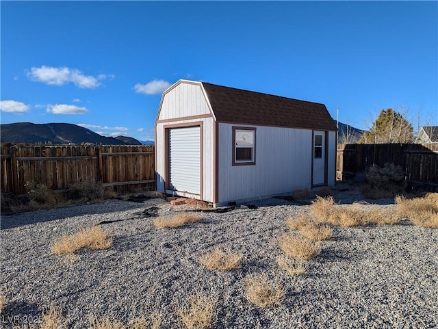 view of outbuilding featuring a mountain view