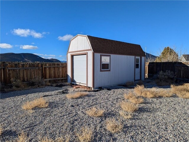 2327 Iron Dr, Ely, NV 89301 - garage with fence and a mountain view