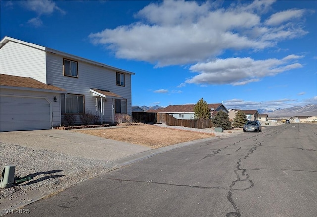 view of front of property with a mountain view