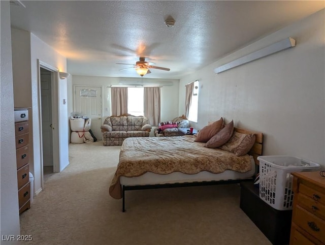 2327 Iron Dr, Ely, NV 89301 - bedroom featuring light carpet, a ceiling fan, and a textured ceiling