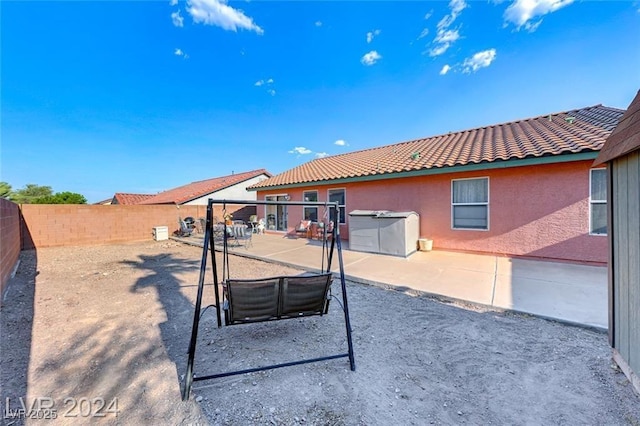 rear view of property with a patio area