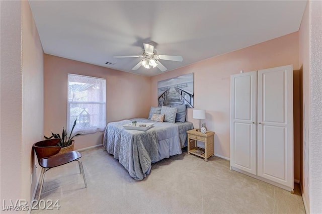 carpeted bedroom with ceiling fan