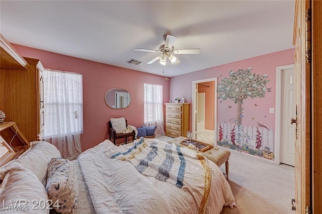 bedroom with light carpet and ceiling fan