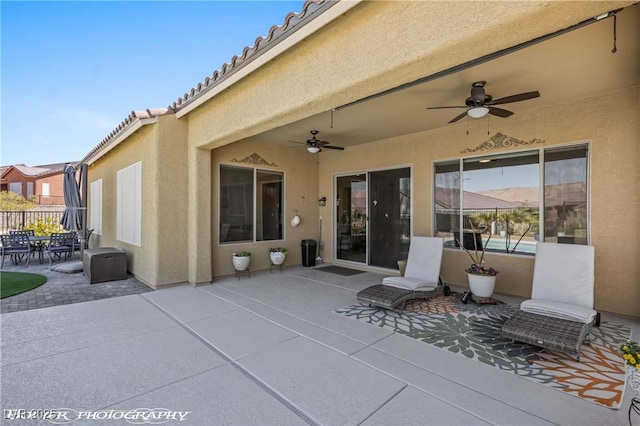 view of patio featuring ceiling fan