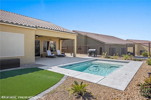 view of pool featuring a patio area, ceiling fan, and area for grilling