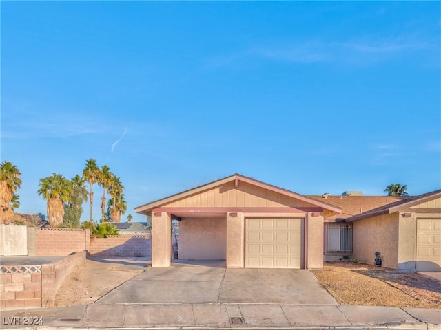 ranch-style home featuring a garage