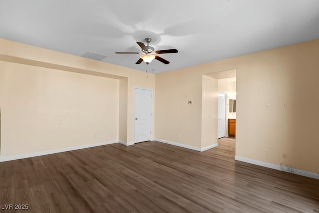 unfurnished room with hardwood / wood-style flooring and ceiling fan