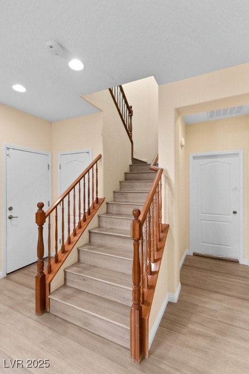 stairway with wood-type flooring